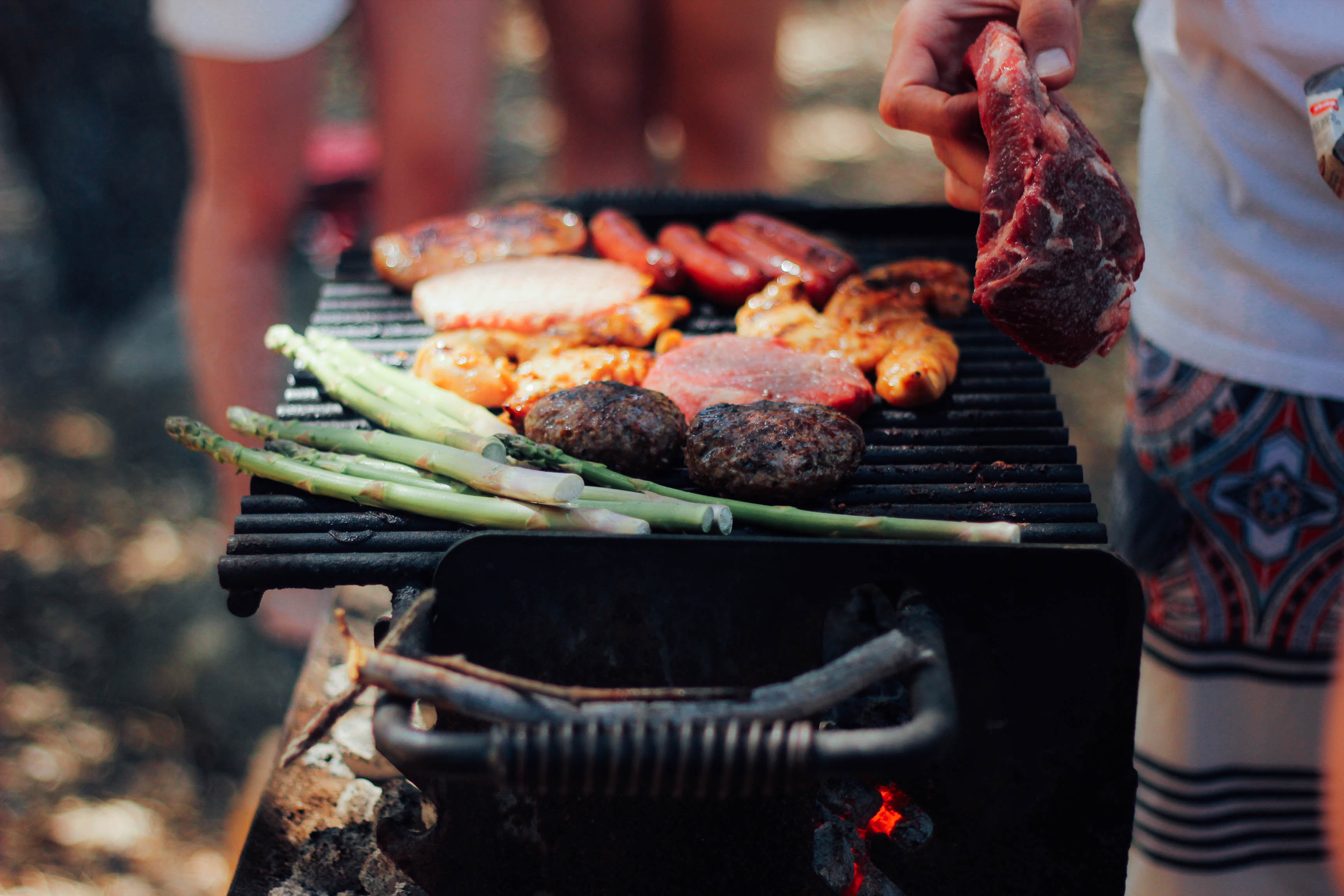 Food cooking on a charcoal barbecue grill